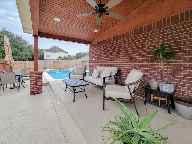 view of patio / terrace with an outdoor hangout area, ceiling fan, and a fenced in pool