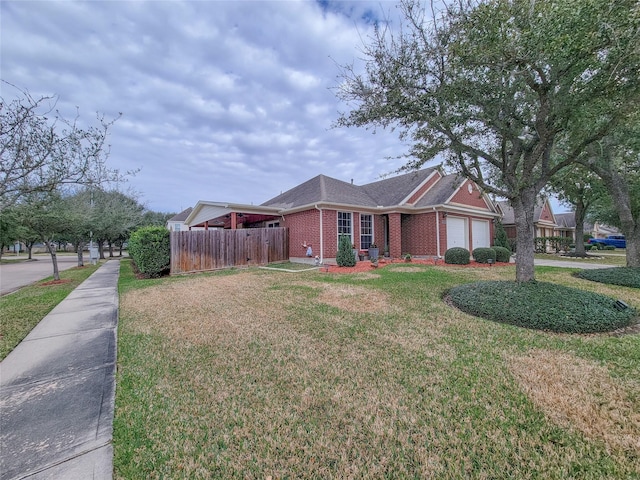 view of front facade featuring a front yard and a garage