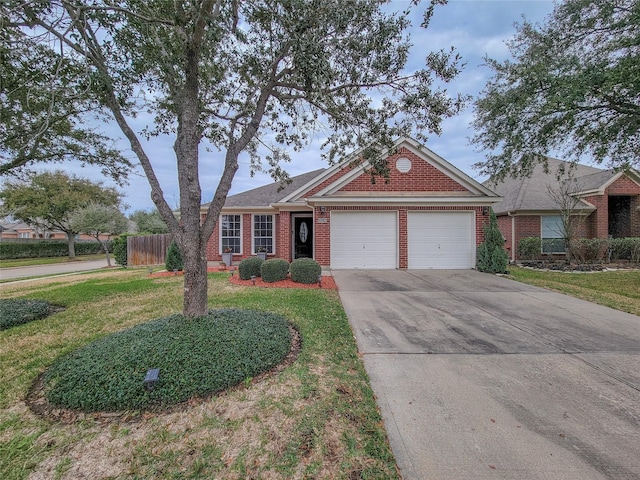 view of front of house featuring a front lawn and a garage