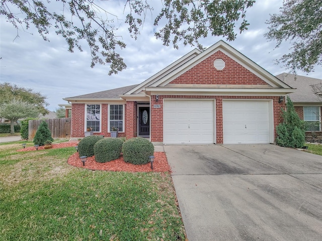 view of front facade featuring a front yard and a garage