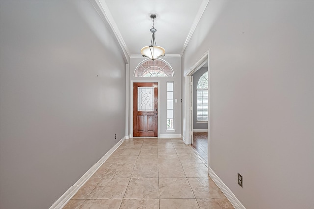 tiled entrance foyer with crown molding