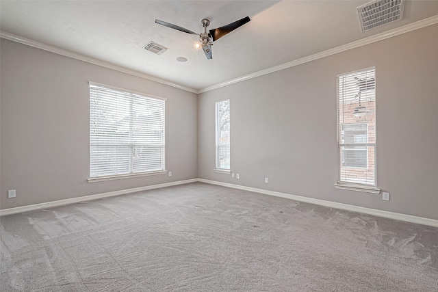 carpeted empty room with crown molding and ceiling fan