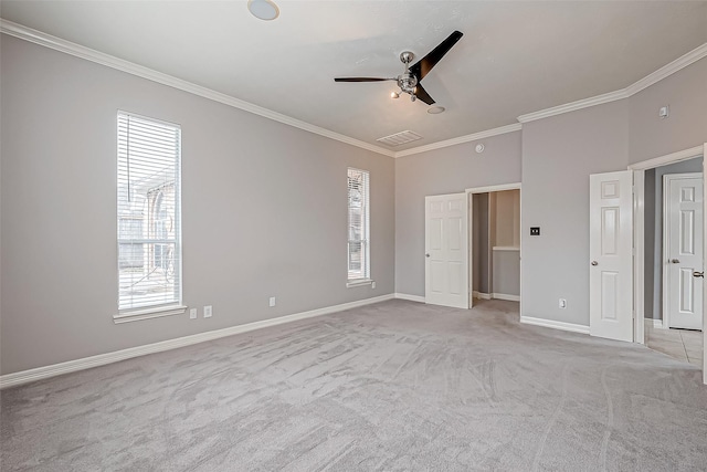 unfurnished bedroom featuring light carpet, ornamental molding, and ceiling fan