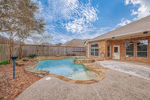 view of pool with a patio and an in ground hot tub