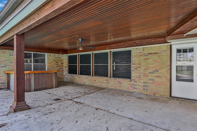 view of patio featuring ceiling fan