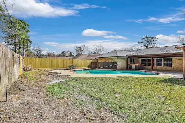 view of pool featuring a patio area and a lawn