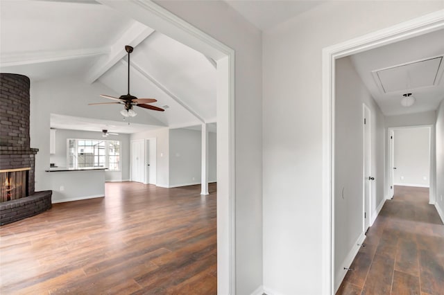 hallway with lofted ceiling with beams and dark wood-type flooring