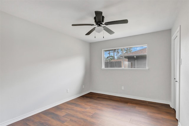 unfurnished bedroom with dark wood-type flooring and ceiling fan