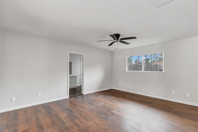 unfurnished room with dark hardwood / wood-style flooring and ceiling fan