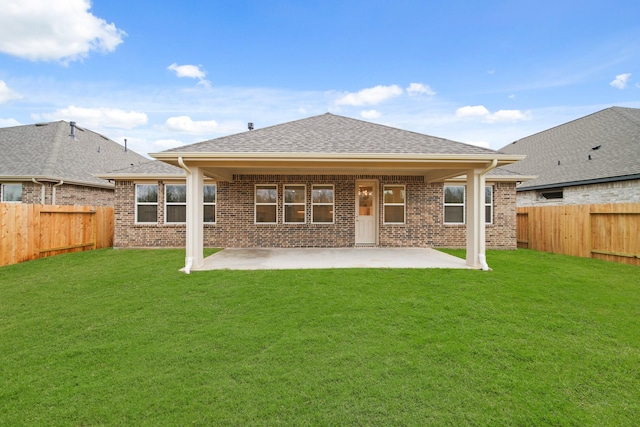 906 Hooks Trl, League City, TX 77573 - rear view of property featuring a patio and a lawn