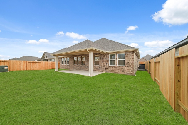 906 Hooks Trl, League City, TX 77573 - rear view of house with a lawn and a patio area