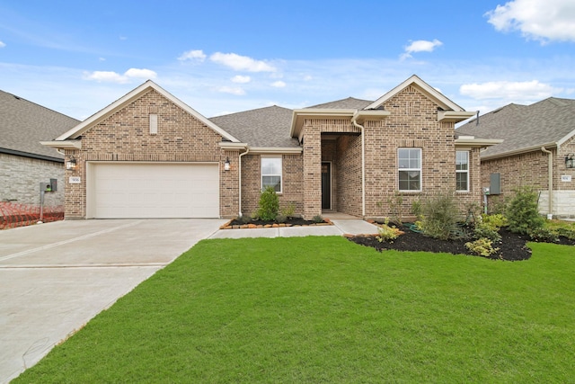 view of front facade with a garage and a front lawn