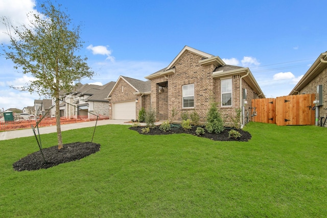 view of front of property with a garage and a front lawn