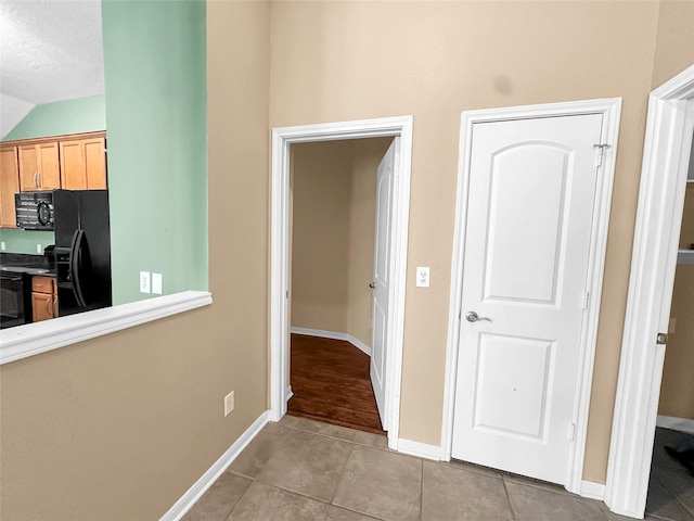 hallway with light tile patterned flooring