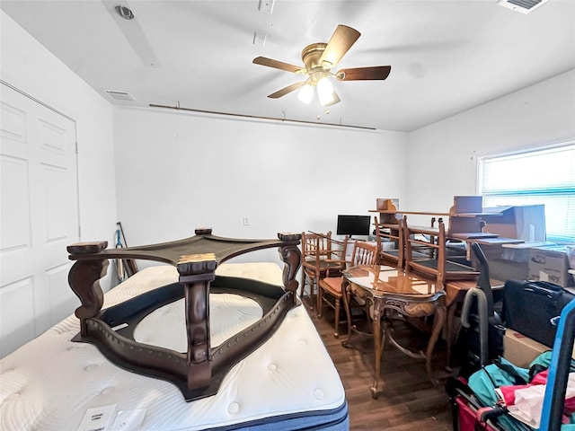 interior space featuring dark wood-type flooring and ceiling fan