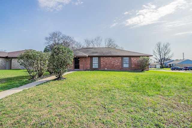 single story home featuring a front yard