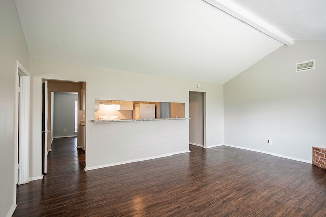 unfurnished living room with dark hardwood / wood-style floors and lofted ceiling with beams