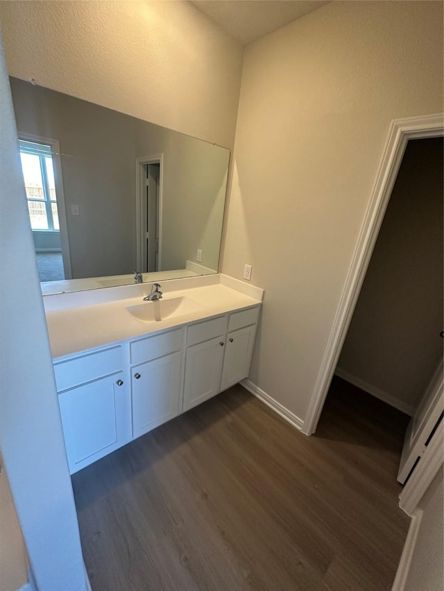 bathroom featuring wood-type flooring and vanity