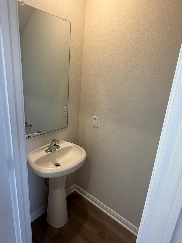 bathroom with wood-type flooring