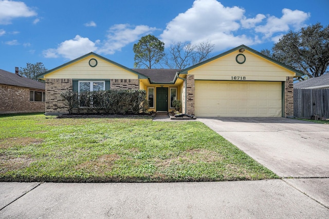 ranch-style home featuring a front yard and a garage