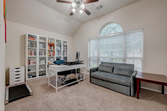 office area featuring visible vents, baseboards, lofted ceiling, ceiling fan, and carpet