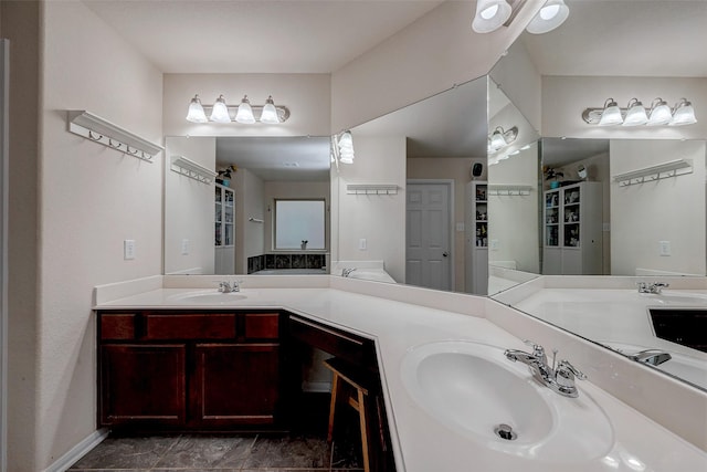 full bath with a sink and double vanity