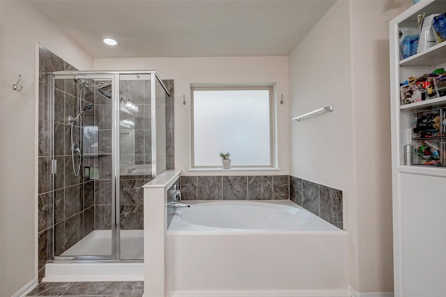 full bathroom with a stall shower and a garden tub