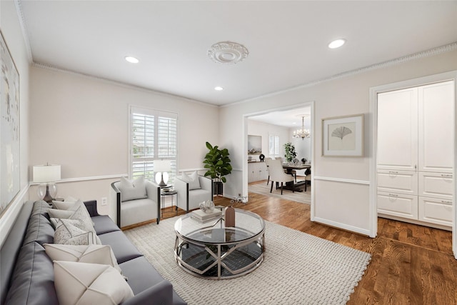 living area featuring recessed lighting, dark wood-style flooring, and ornamental molding