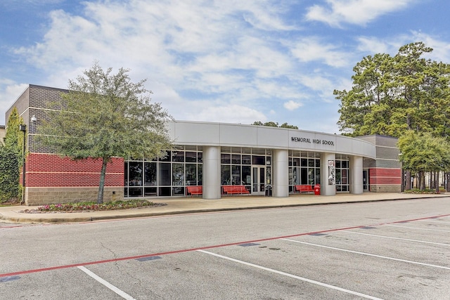 view of property featuring uncovered parking