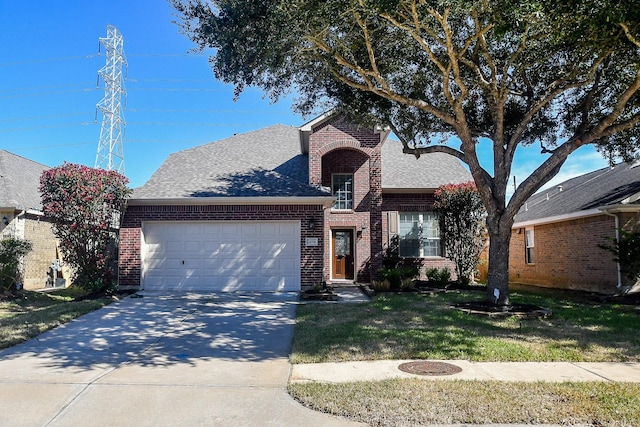 view of front facade with a garage and a front yard