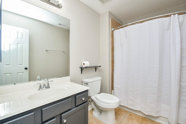 bathroom featuring vanity, tile patterned floors, toilet, and a shower with shower curtain