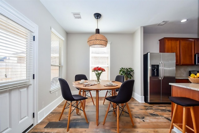 dining area featuring hardwood / wood-style flooring