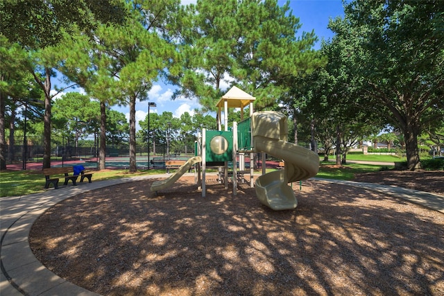 community jungle gym featuring fence