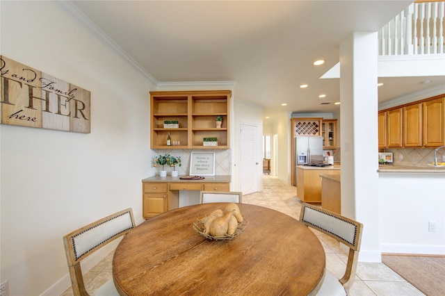 dining room with recessed lighting, baseboards, ornamental molding, and light tile patterned flooring