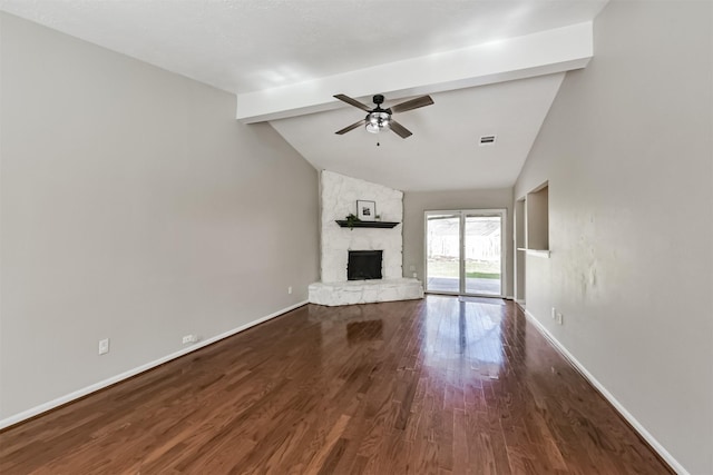 unfurnished living room with a stone fireplace, high vaulted ceiling, hardwood / wood-style flooring, ceiling fan, and beam ceiling