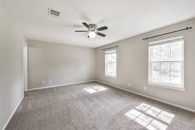 unfurnished room with carpet, a textured ceiling, and ceiling fan