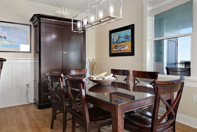 dining room with an inviting chandelier and light hardwood / wood-style floors