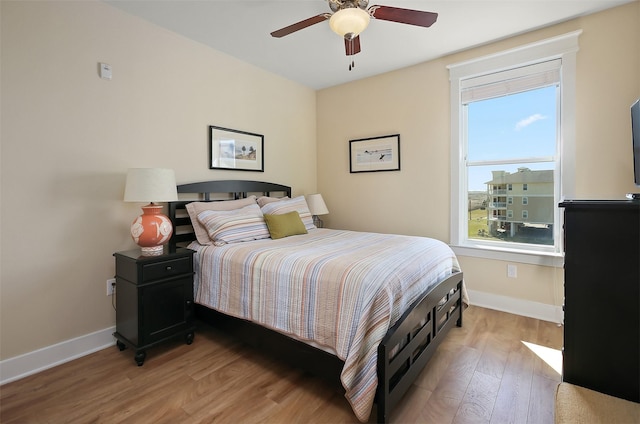 bedroom featuring ceiling fan and light wood-type flooring