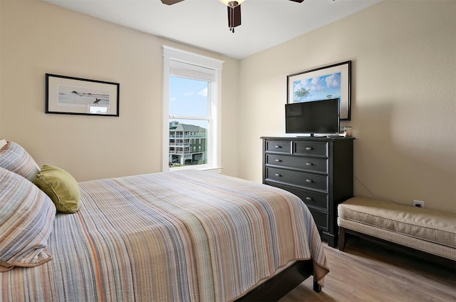 bedroom featuring hardwood / wood-style floors and ceiling fan