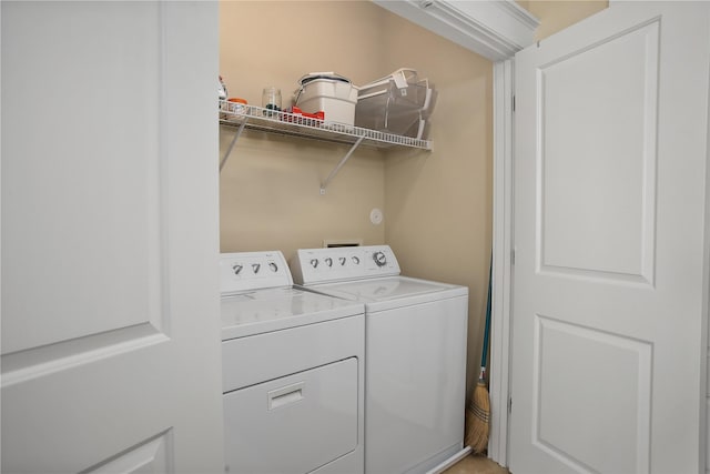 washroom with washer and dryer