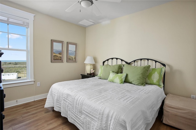 bedroom with hardwood / wood-style flooring and ceiling fan