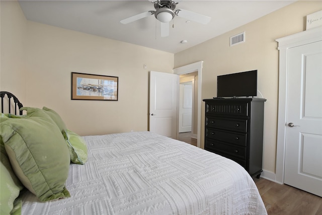 bedroom featuring hardwood / wood-style flooring and ceiling fan