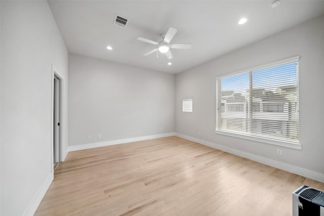 unfurnished room with ceiling fan and light hardwood / wood-style flooring