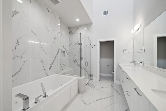 full bathroom featuring toilet, vanity, and shower with separate bathtub