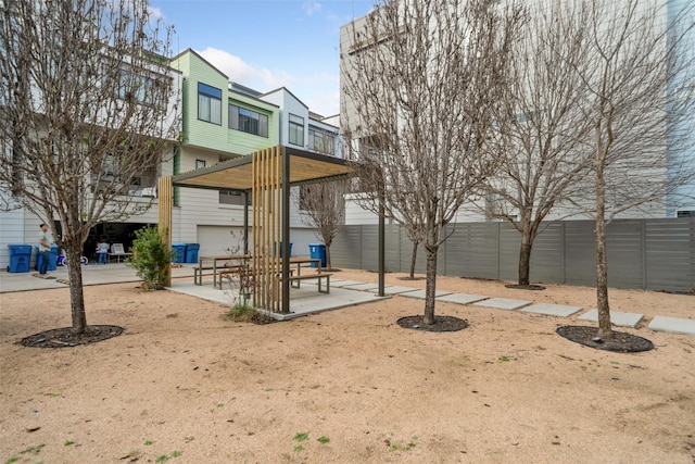 view of playground featuring a patio area