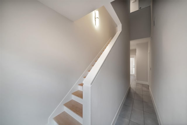 stairs with tile patterned floors