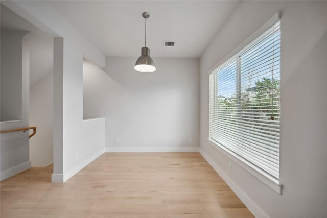 unfurnished dining area with light hardwood / wood-style floors