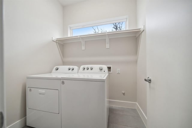 laundry area with tile patterned flooring and washing machine and clothes dryer