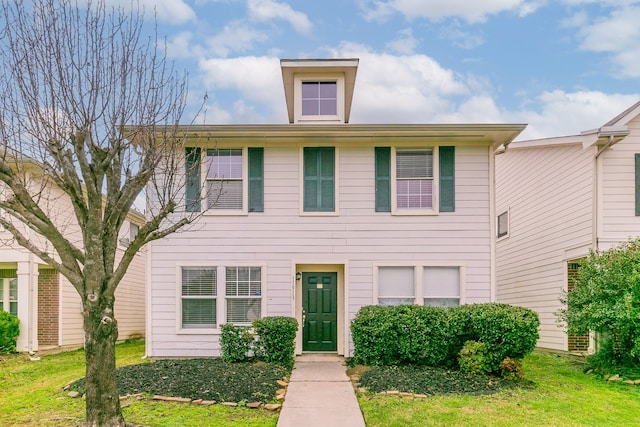 view of front of home featuring a front yard