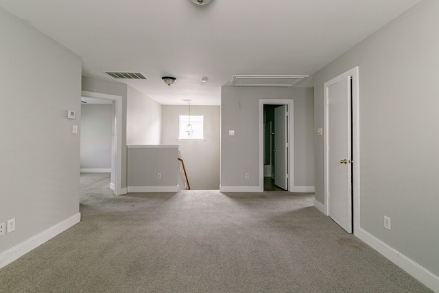 empty room featuring light carpet